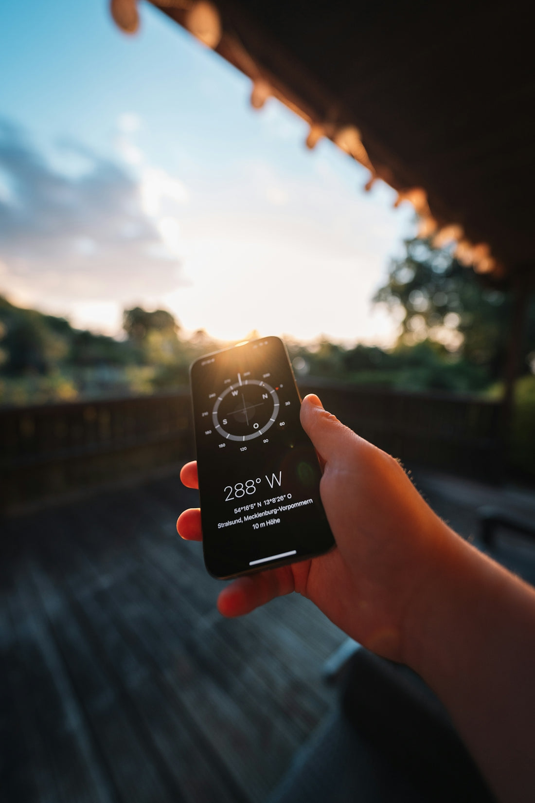 A person holding a cell phone in their hand