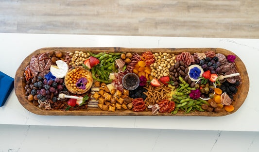 A delicious charcuterie board is ready to eat.